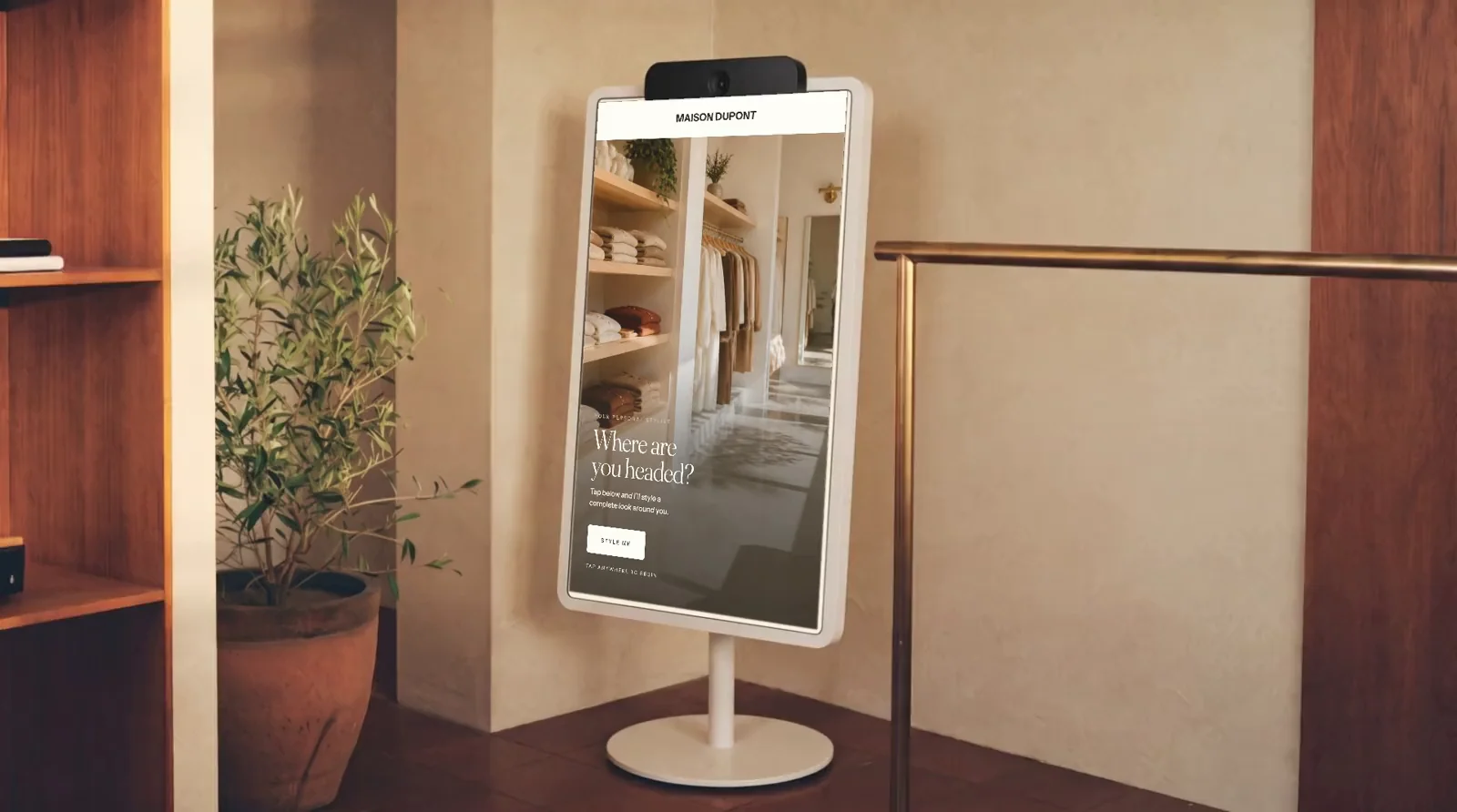Pierre smart mirror for retail showing virtual try-on outfits in a boutique